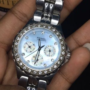 Blue and silver fossil watch